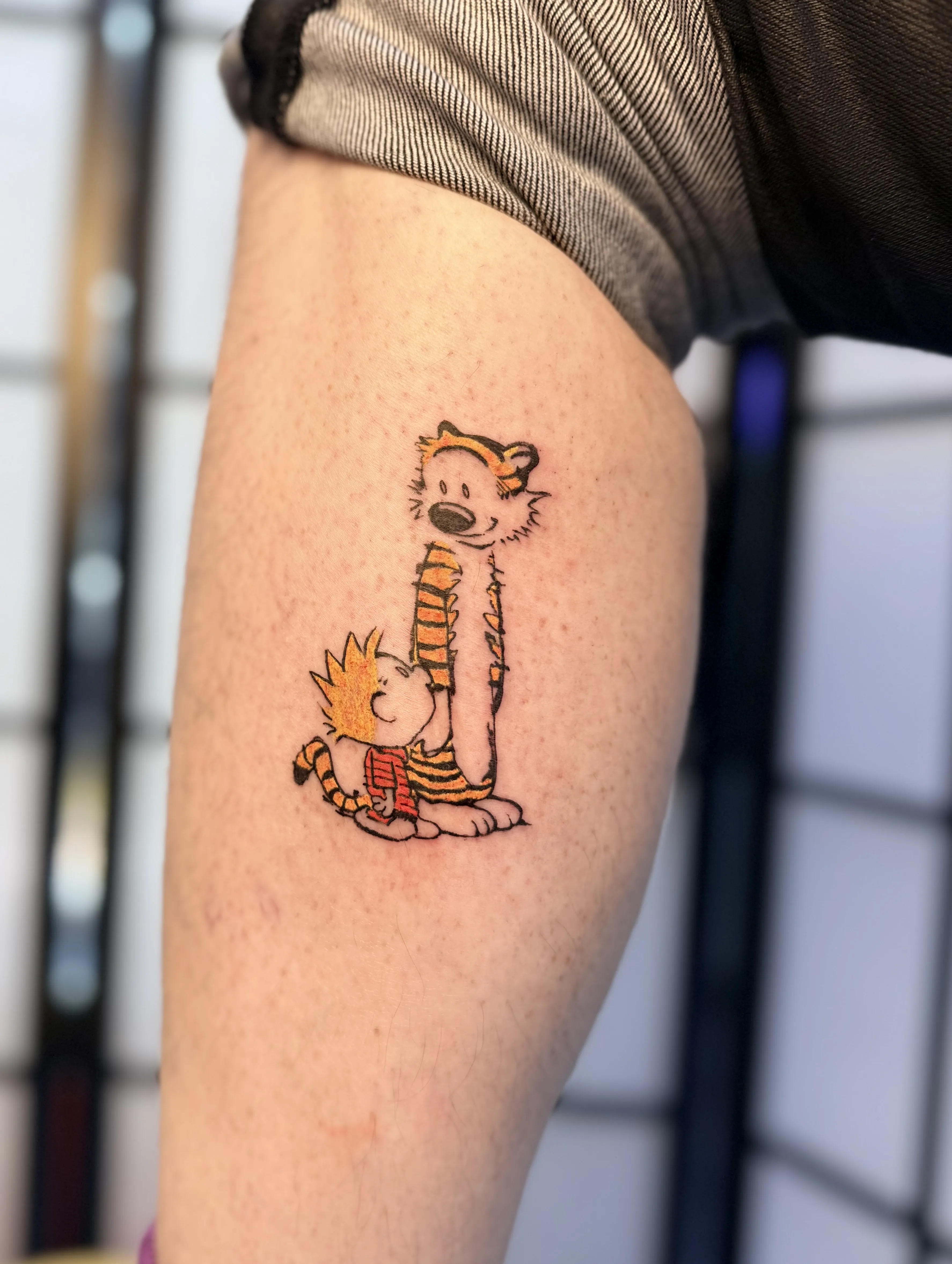 Colour Calvin and Hobbes character piece on an arm, shoji screen behind