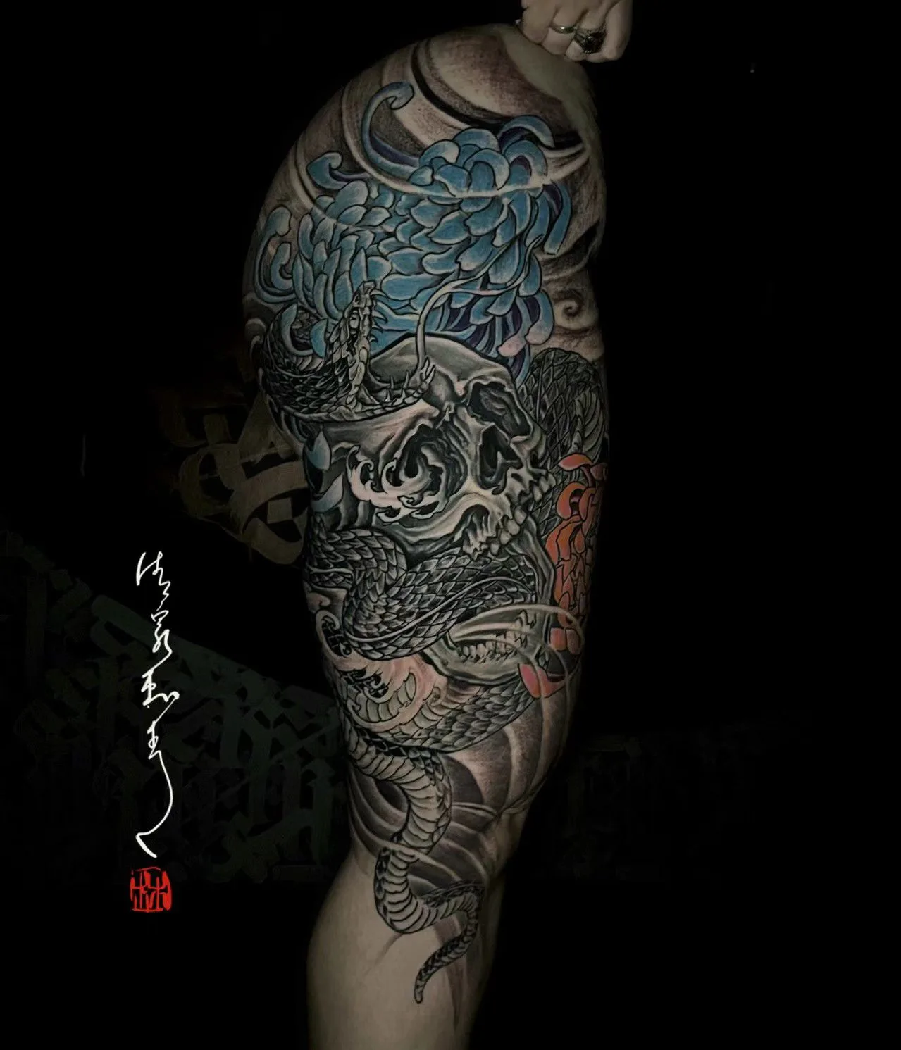 Japanese skull, serpent and blue chrysanthemum thigh piece